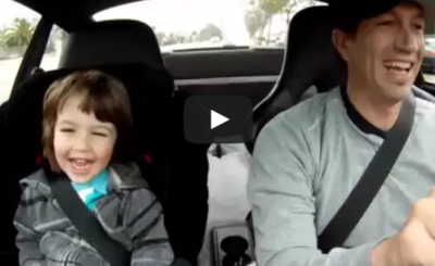 My boy laughing in the Porsche on the way to school..