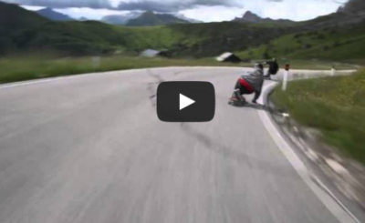 Skateboarders racing cyclists in the ALPS