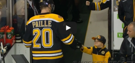 Young Fan Fist Bumps Boston Bruins after Pregame Warm Up