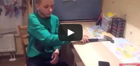 Kid tests his phone case with a hammer and breaks it!