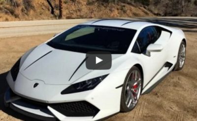 Lamborghini driver encounters car pulling log on a chain