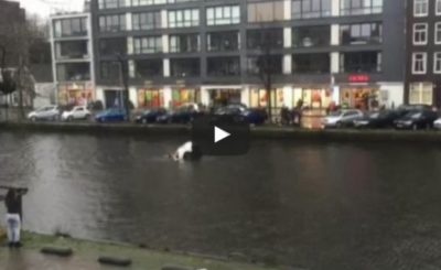 Four men save a woman and child from a sinking car in Amsterdam